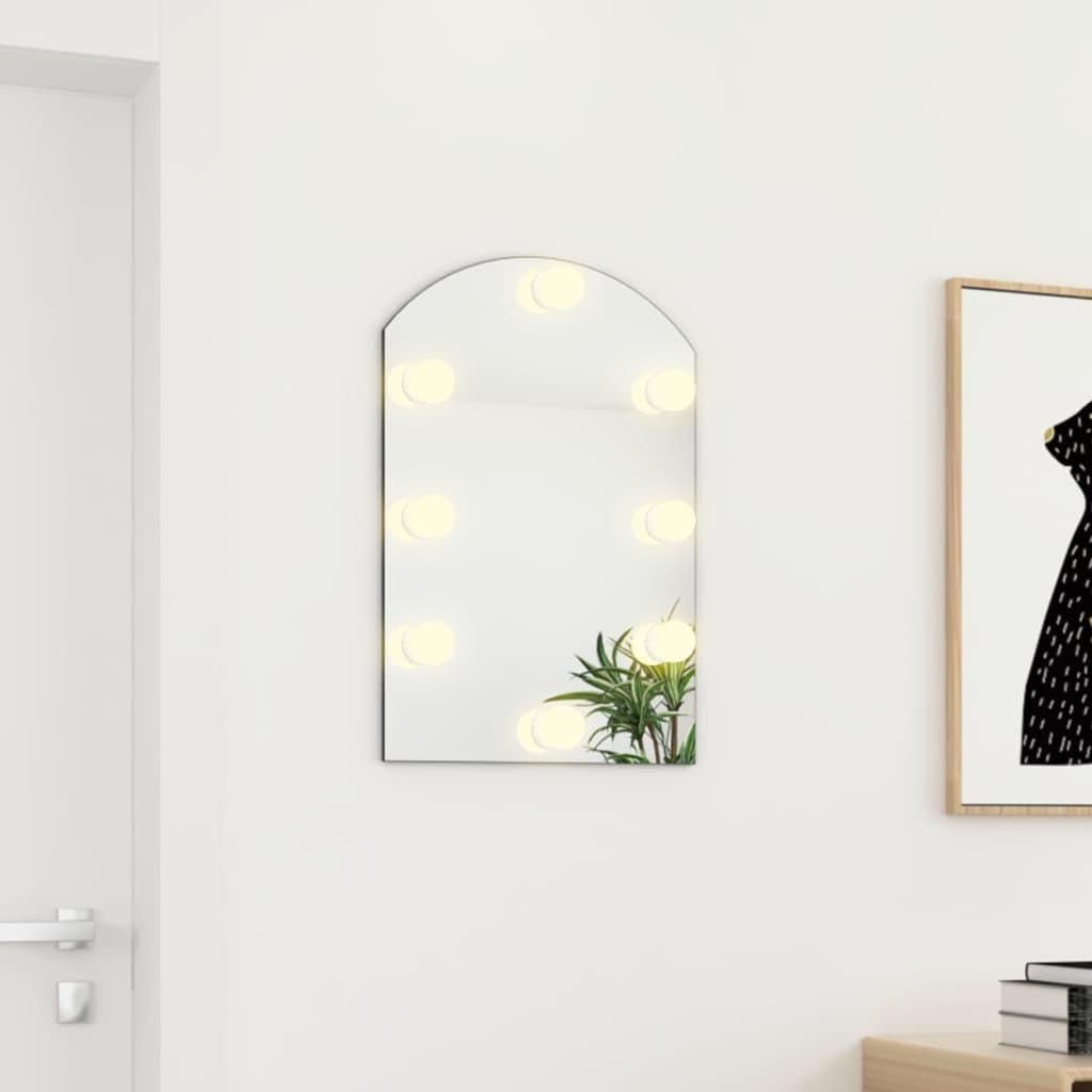 Spejl med LED-lamper 60x40 cm buet glas